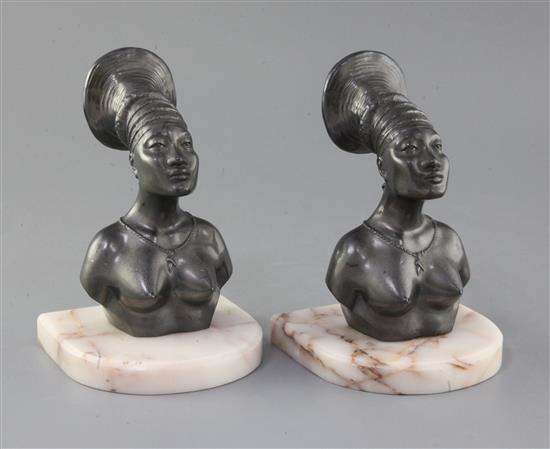 A pair of bronzed metal and onyx bookends of Mangbetu Tribe women from the Belgian Congo, height 7in.